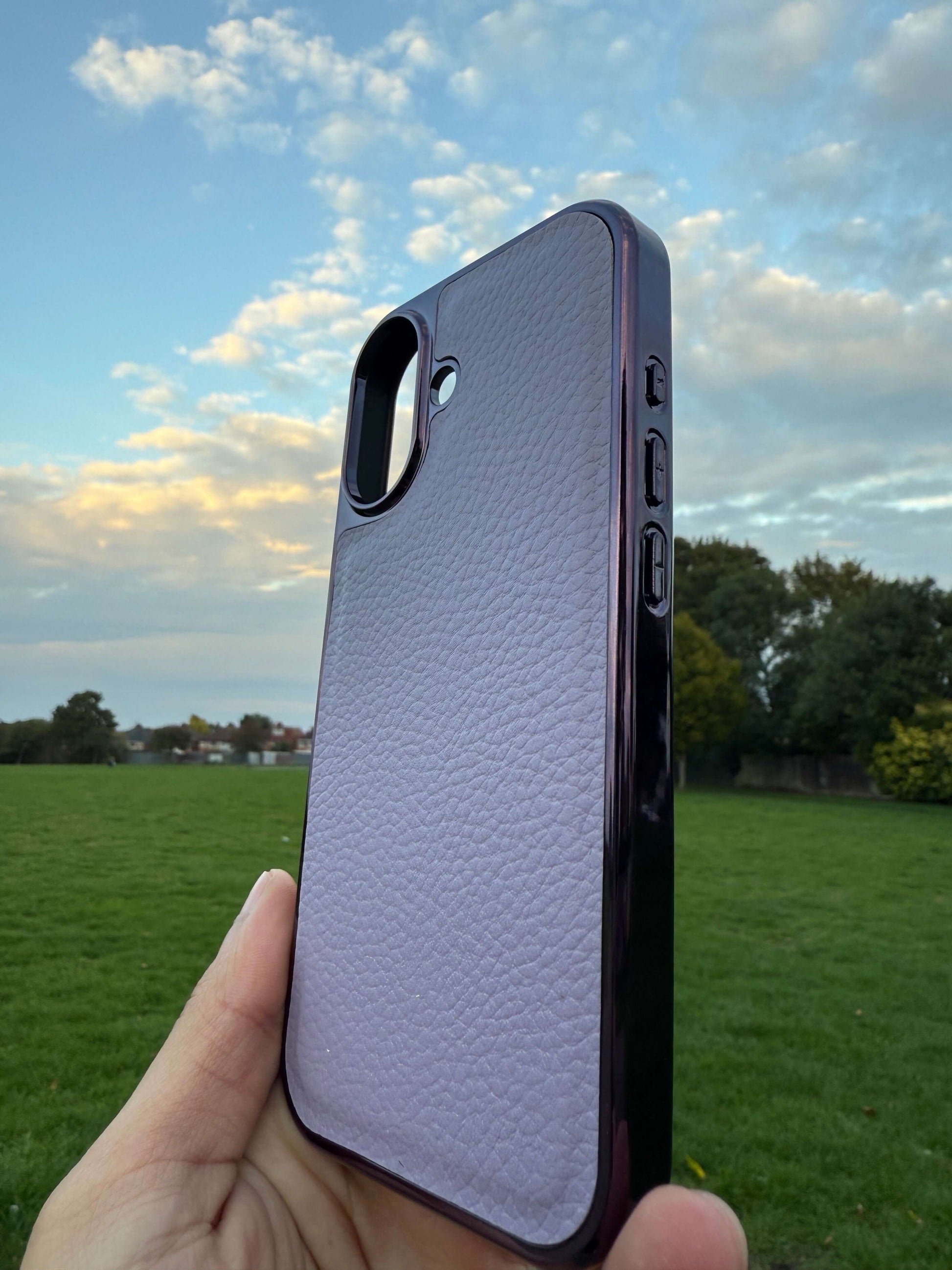Premium Protection Kit iPhone 17 showcasing a handcrafted leather back case against a scenic sky.