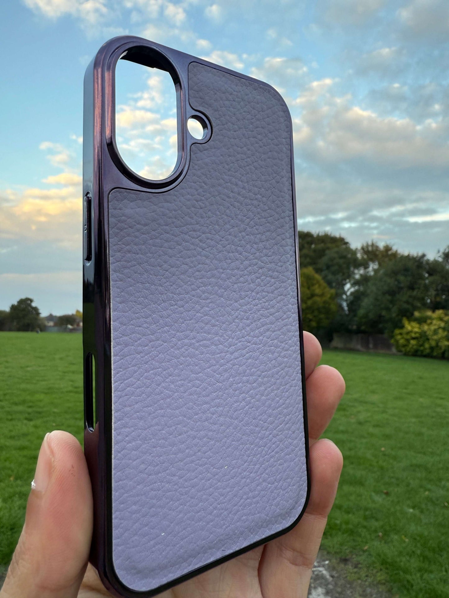 Premium Protection Kit iPhone 17 showcased in a hand against a scenic sky backdrop, highlighting the sleek design.